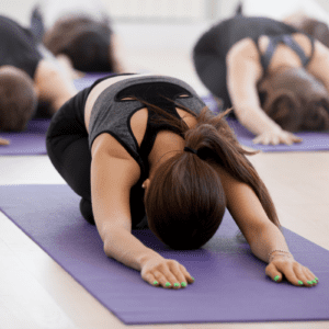 People in a yoga pose at class.