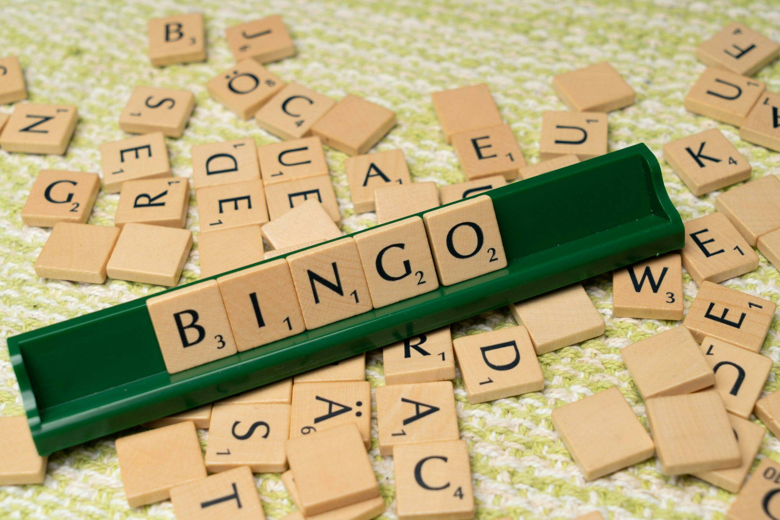 Bingo spelled out on a scrabble tile holder.